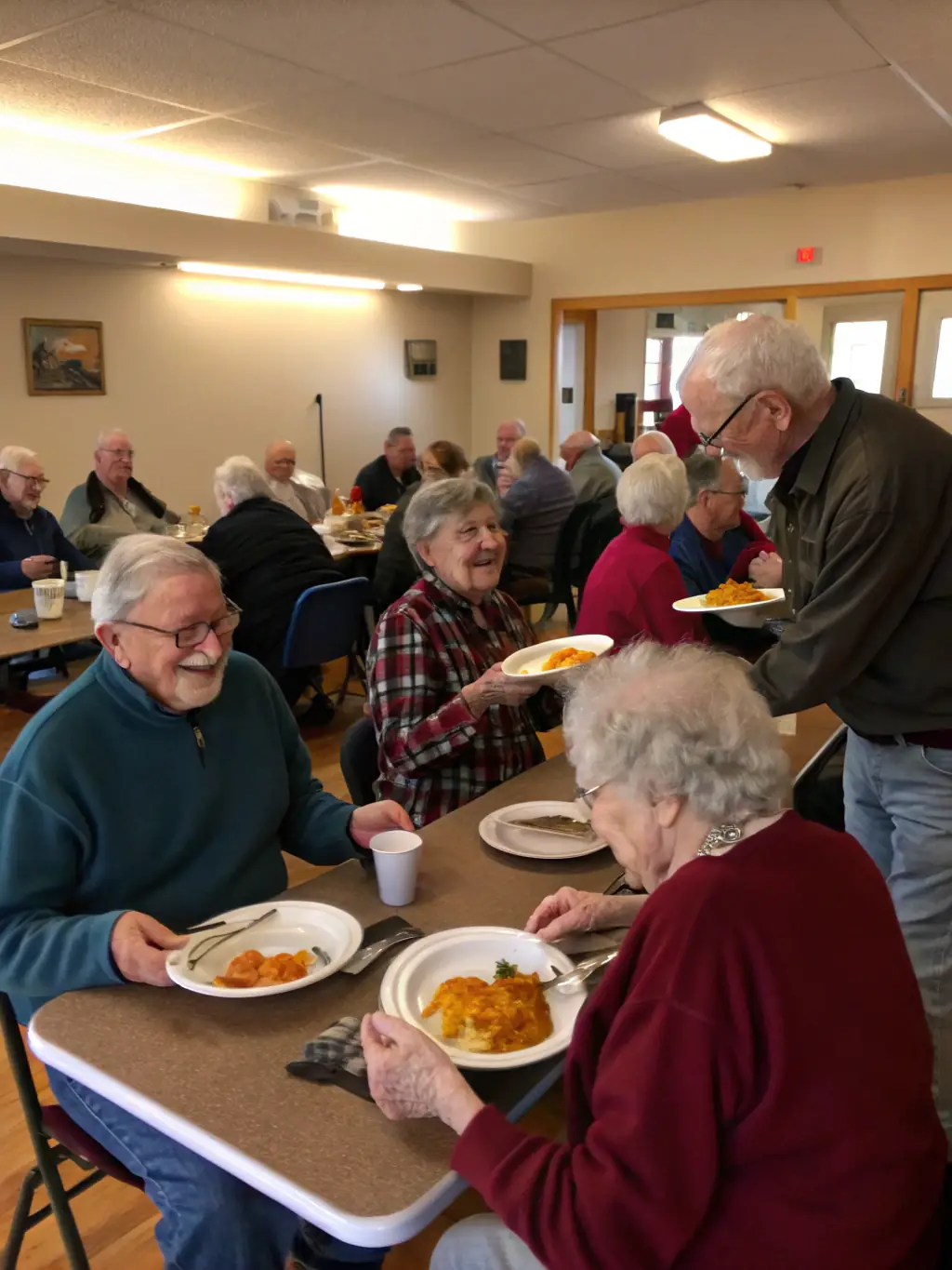 A photo of volunteers giving a presentation on fire safety to a group of senior citizens in a community center, emphasizing the association's commitment to public education.